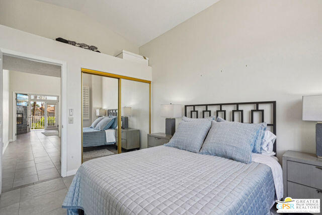 364 Oakmont Drive Palm Desert, CA 92211 - Photo 39 of 74 a bedroom with a large bed and a large window