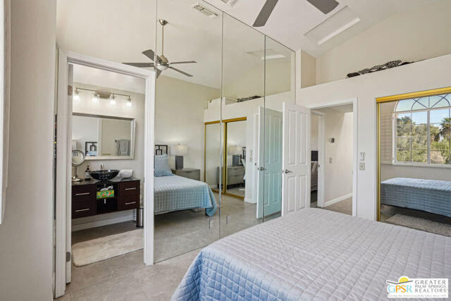 364 Oakmont Drive Palm Desert, CA 92211 - Photo 40 of 74 a bedroom with a bed and a walk in closet