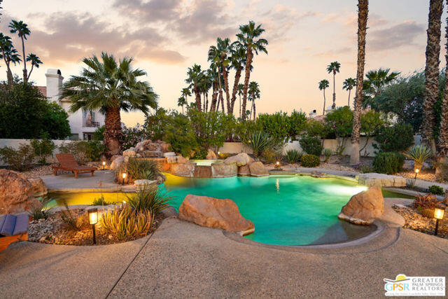 364 Oakmont Drive Palm Desert, CA 92211 - Photo 4 of 74 a view of a swimming pool and lounge chair