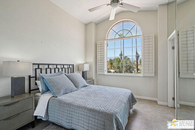 364 Oakmont Drive Palm Desert, CA 92211 - Photo 41 of 74 a bedroom with a bed and a window