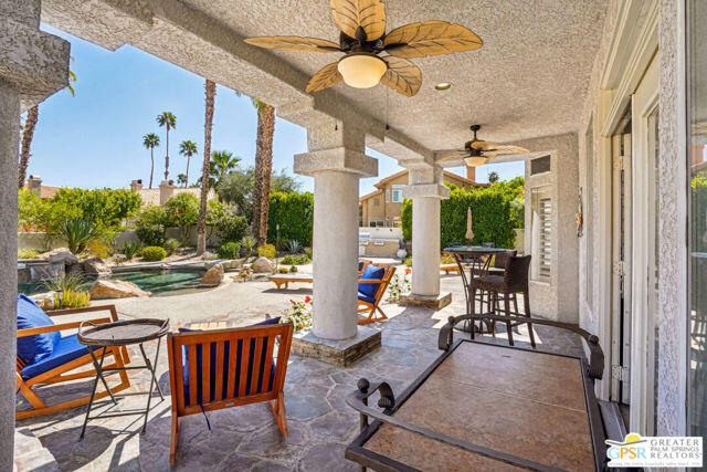 364 Oakmont Drive Palm Desert, CA 92211 - Photo 43 of 74 a view of a patio with a table and chairs