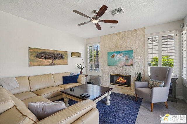 364 Oakmont Drive Palm Desert, CA 92211 - Photo 46 of 74 a living room with furniture fireplace and window