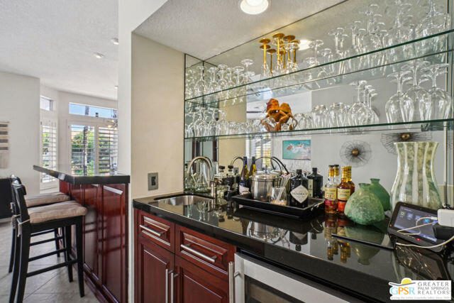 364 Oakmont Drive Palm Desert, CA 92211 - Photo 48 of 74 a kitchen with lots of counter top space and dining table
