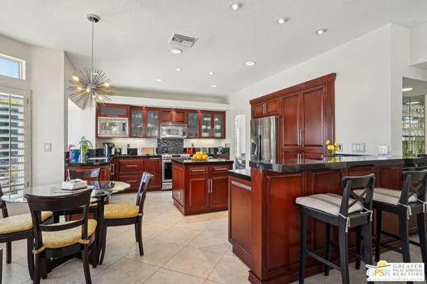 a view of a dining room with furniture window and outside view