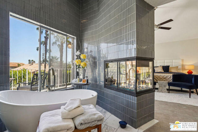 364 Oakmont Drive Palm Desert, CA 92211 - Photo 61 of 74 a living room with furniture and a large window