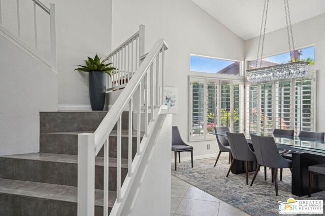 364 Oakmont Drive Palm Desert, CA 92211 - Photo 68 of 74 a view of a livingroom with furniture staircase and front door
