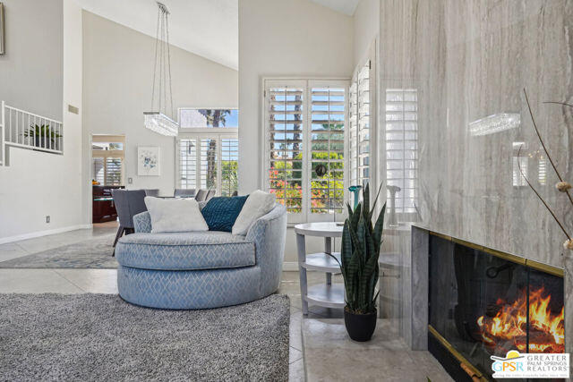 364 Oakmont Drive Palm Desert, CA 92211 - Photo 71 of 74 a living room with furniture and a fireplace