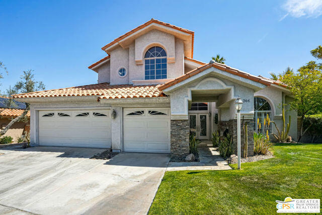 364 Oakmont Drive Palm Desert, CA 92211 - Photo 9 of 74 a front view of a house with a yard