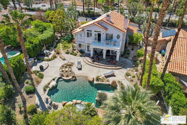 364 Oakmont Drive Palm Desert, CA 92211 - Photo 10 of 74 an aerial view of a house with yard and garden