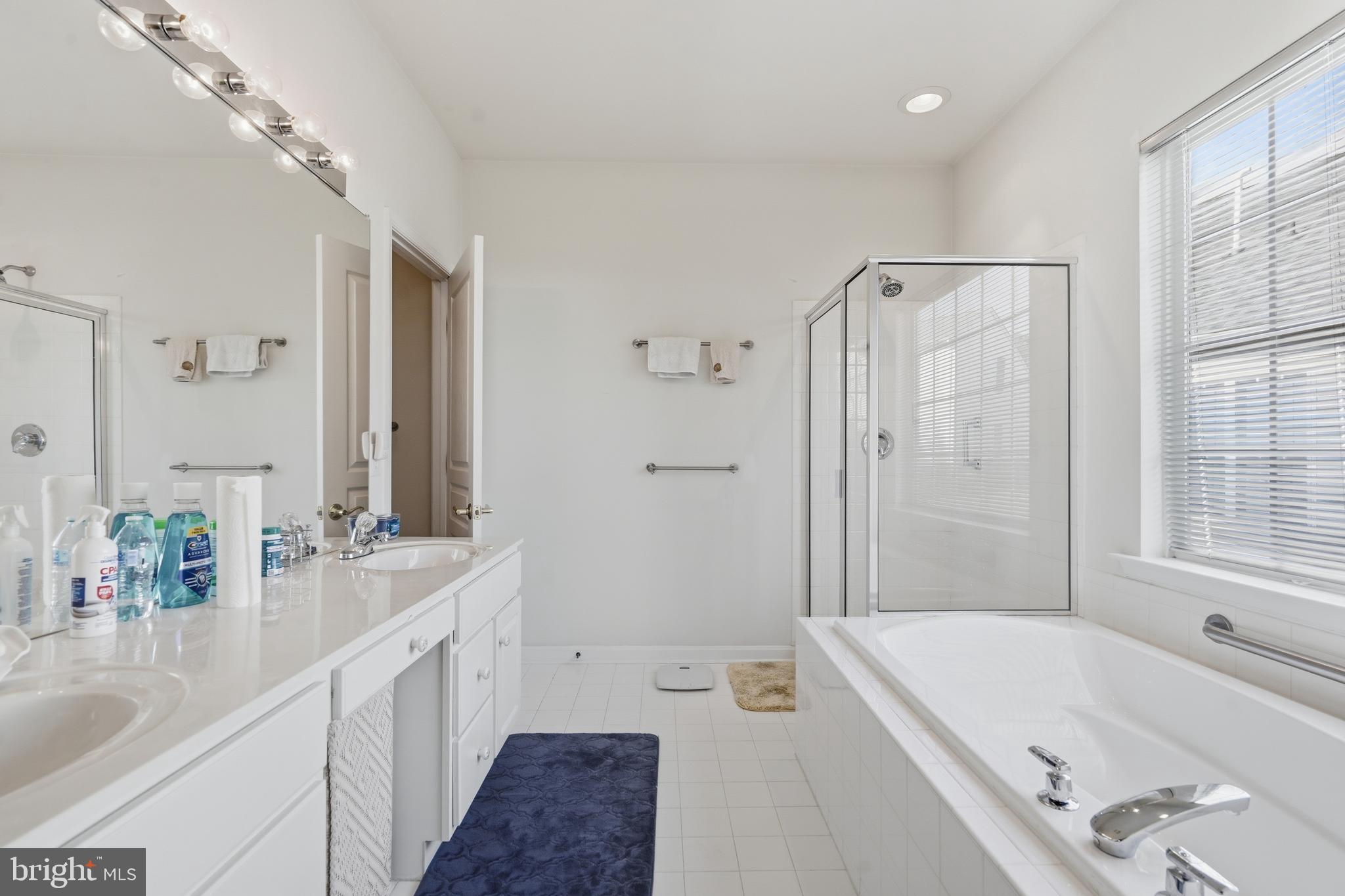 29 Pennington Court Delanco, NJ 08075 - Photo 22 of 57 a bathroom with a tub sink and mirror