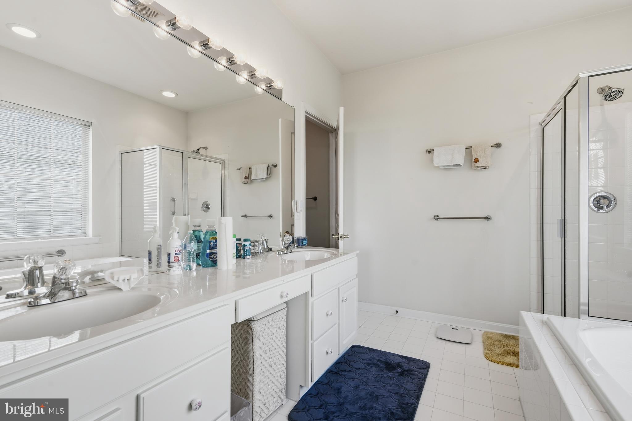 29 Pennington Court Delanco, NJ 08075 - Photo 23 of 57 a bathroom with a sink double vanity granite tub shower and a mirror