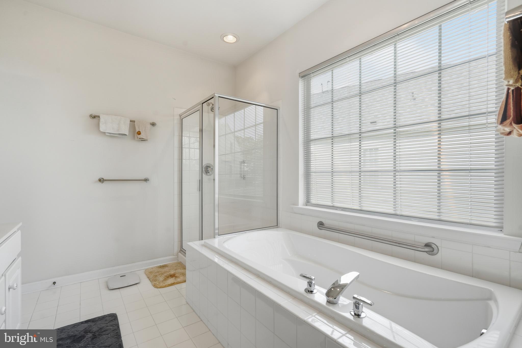 29 Pennington Court Delanco, NJ 08075 - Photo 24 of 57 a bathroom with a tub a sink and a window