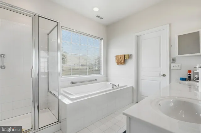 an aerial view of a house with garden space and a house