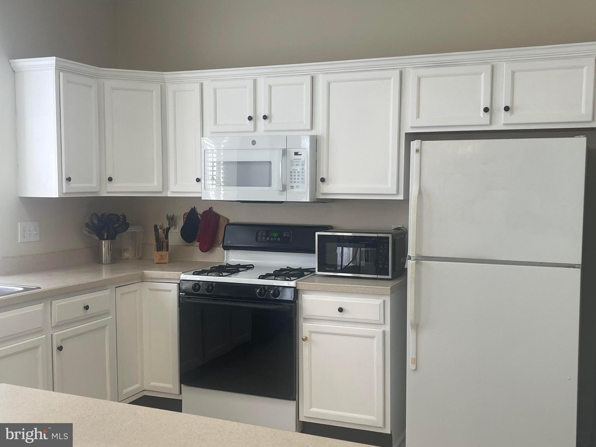 29 Pennington Court Delanco, NJ 08075 - Photo 4 of 57 a kitchen with stainless steel appliances granite countertop white refrigerator stove a sink and dishwasher