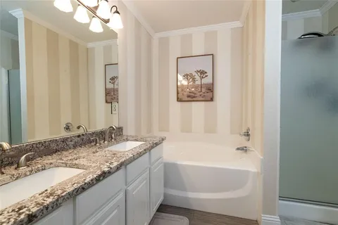 a bathroom with a bathtub and a sink