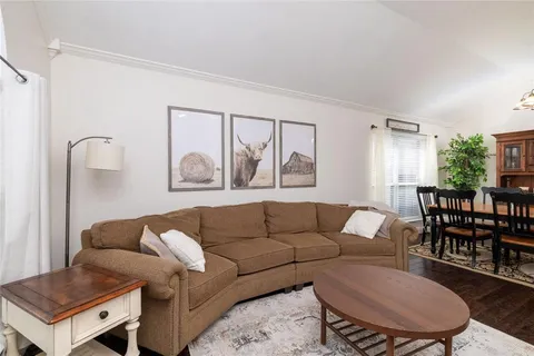 a living room with furniture and a table