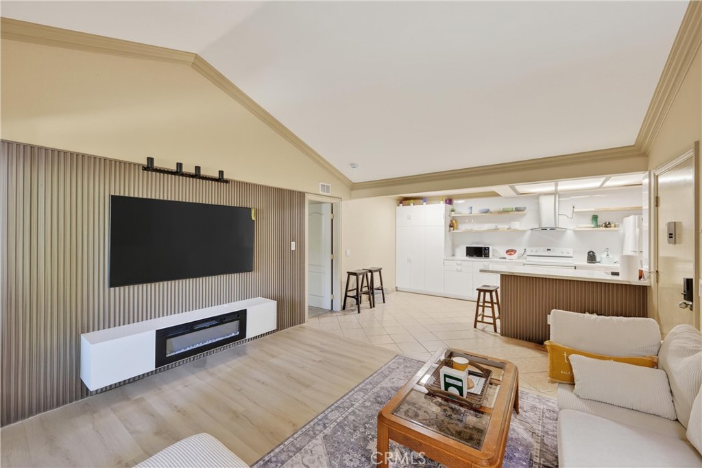 3535 Banbury Drive, Unit 14 Riverside, CA 92505 - Photo 4 of 17 a living room with furniture and a flat screen tv