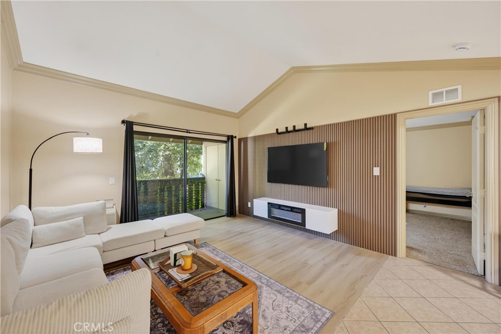 3535 Banbury Drive, Unit 14 Riverside, CA 92505 - Photo 6 of 17 a living room with furniture and a flat screen tv
