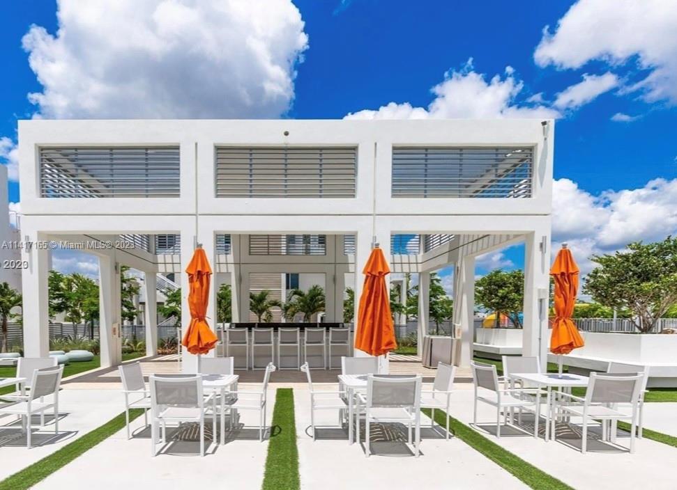 Doral Doral, FL 33178 - Photo 1 of 16 a building outdoor space with patio furniture and potted plants