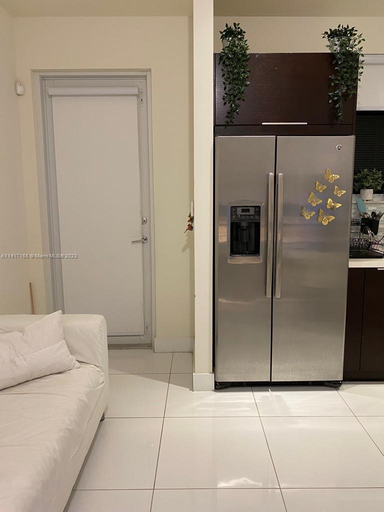 Doral Doral, FL 33178 - Photo 13 of 16 a view of a livingroom with kitchen appliances