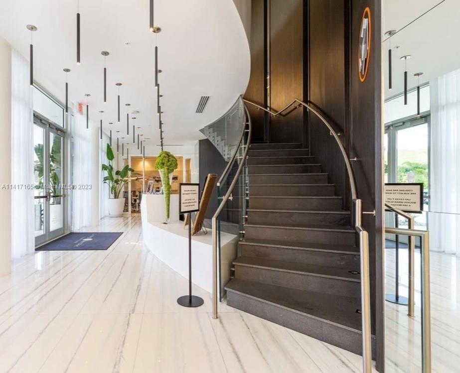 Doral Doral, FL 33178 - Photo 7 of 16 a view of entryway and hall with wooden floor