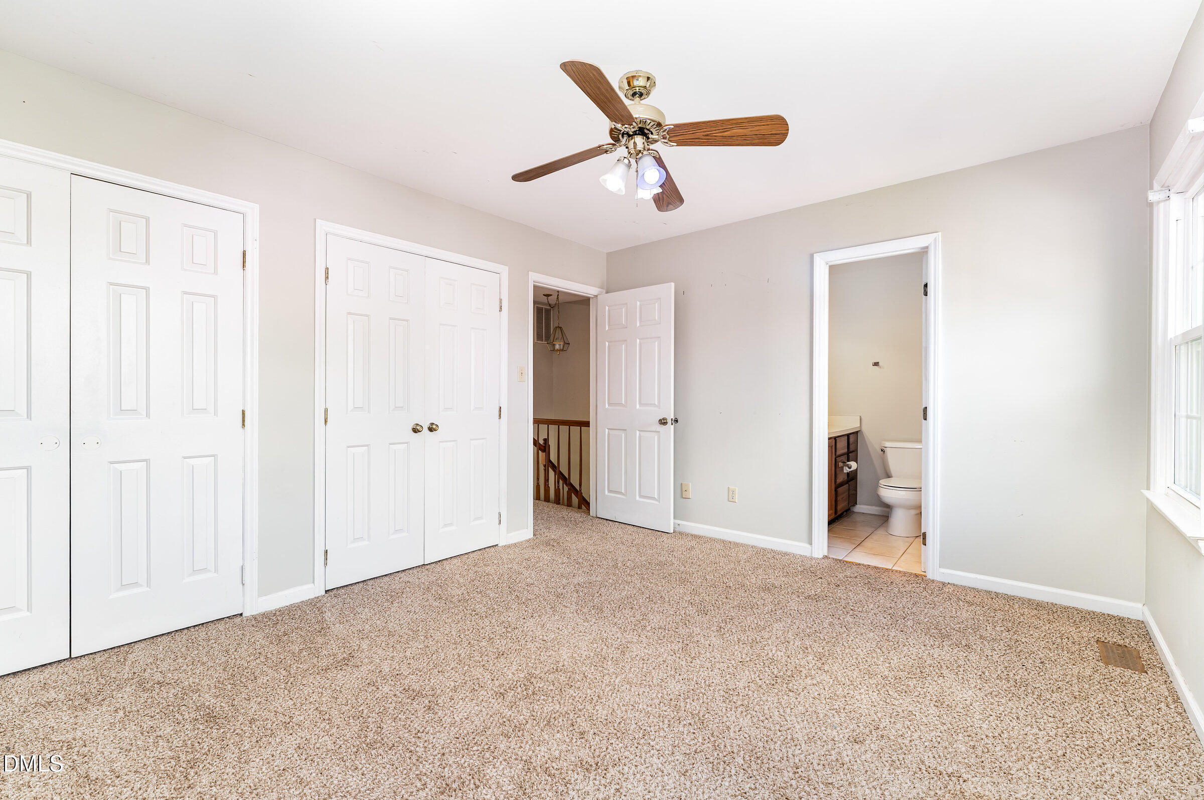 6205 Waterside Lane Raleigh, NC 27613 - Photo 30 of 40 a view of a livingroom with a ceiling fan
