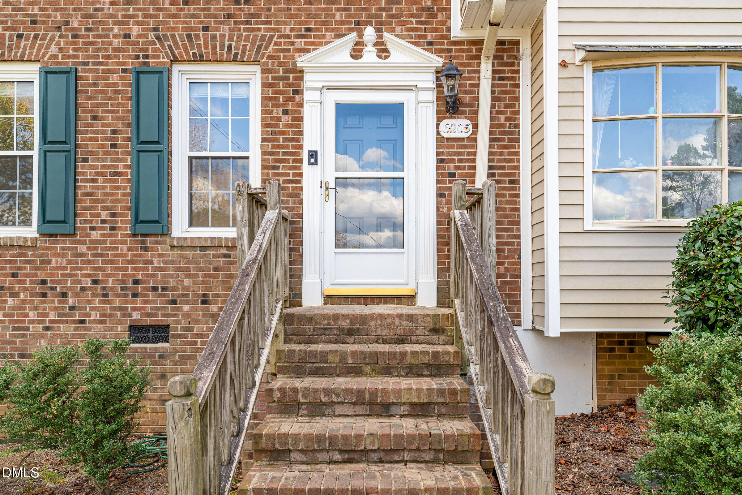 6205 Waterside Lane Raleigh, NC 27613 - Photo 6 of 40 a front view of a house with large windows