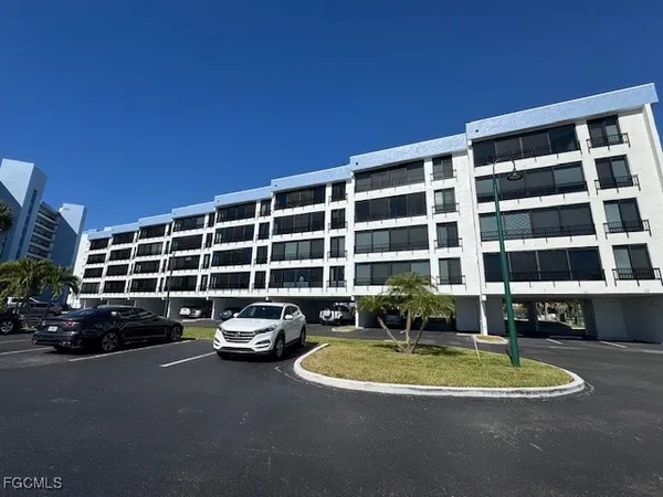a view of a building and car parked
