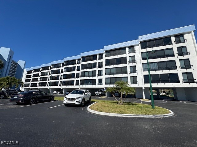 a view of a building and car parked