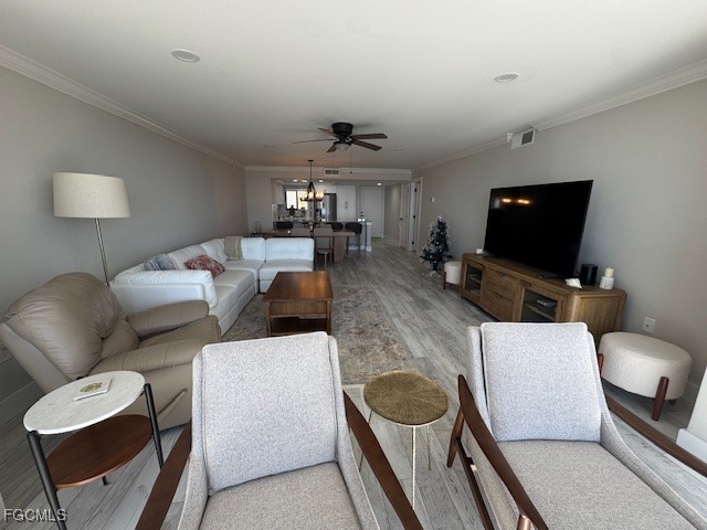 15010 Punta Rassa Road, Unit 404 Fort Myers, FL 33908 - Photo 15 of 29 a living room with furniture and a flat screen tv
