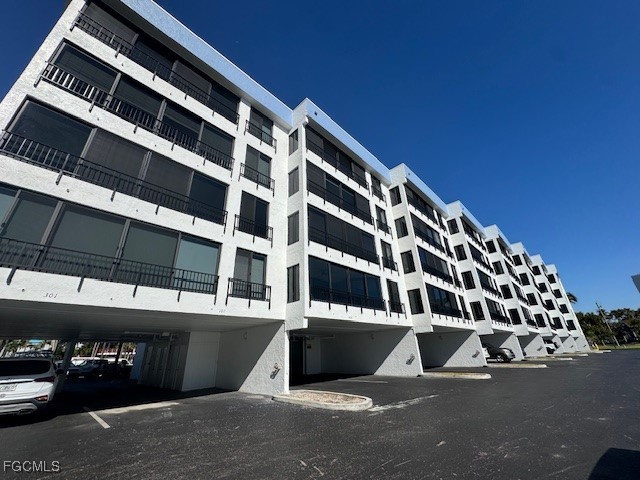 15010 Punta Rassa Road, Unit 404 Fort Myers, FL 33908 - Photo 2 of 29 a view of building with view of building