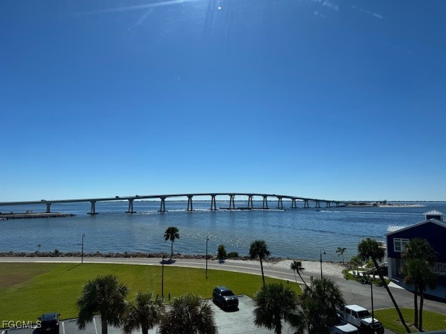 15010 Punta Rassa Road, Unit 404 Fort Myers, FL 33908 - Photo 23 of 29 a view of a swimming pool and a yard