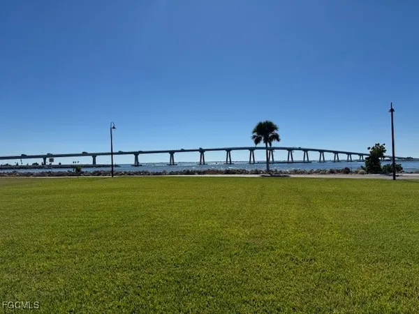 a view of a swimming pool with a yard
