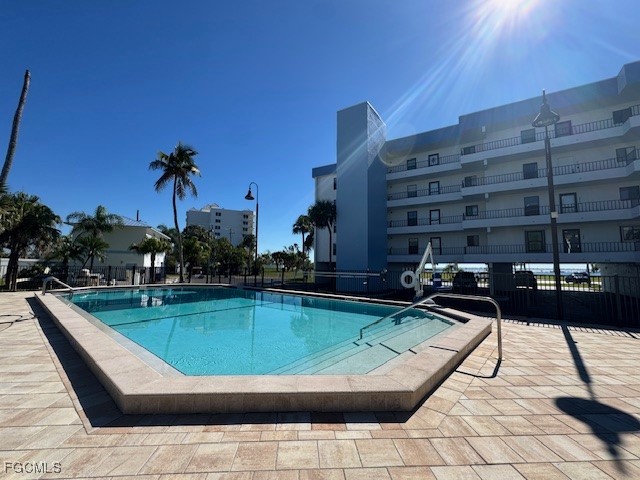 15010 Punta Rassa Road, Unit 404 Fort Myers, FL 33908 - Photo 28 of 29 a view of swimming pool with outdoor seating