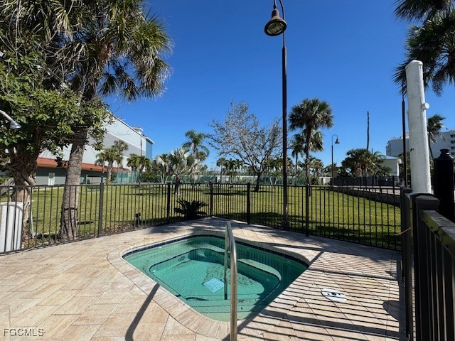 15010 Punta Rassa Road, Unit 404 Fort Myers, FL 33908 - Photo 29 of 29 a view of a swimming pool with a patio and a garden
