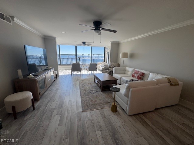 15010 Punta Rassa Road, Unit 404 Fort Myers, FL 33908 - Photo 8 of 29 a living room with furniture and a large window