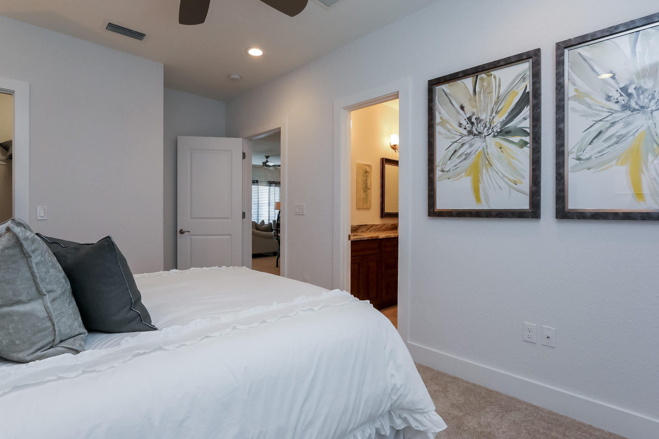 995 Airport Road, Unit 5 Destin, FL 32541 - Photo 26 of 26 a bedroom with a bed and painting on the wall