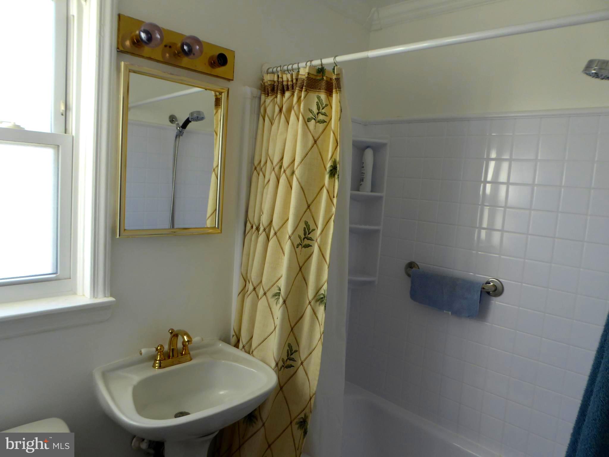 3010 Findley Road Kensington, MD 20895 - Photo 10 of 31 Full bath on first flloor wit curtain pulled back