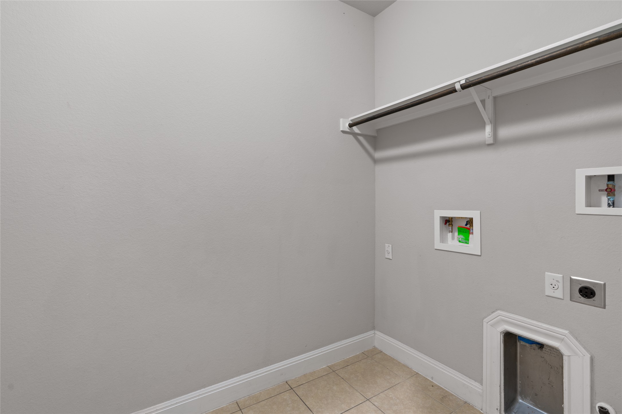 15601 Cabrillo Way Austin, TX 78738 - Photo 16 of 32 Utility room featuring light gray walls and tiled flooring