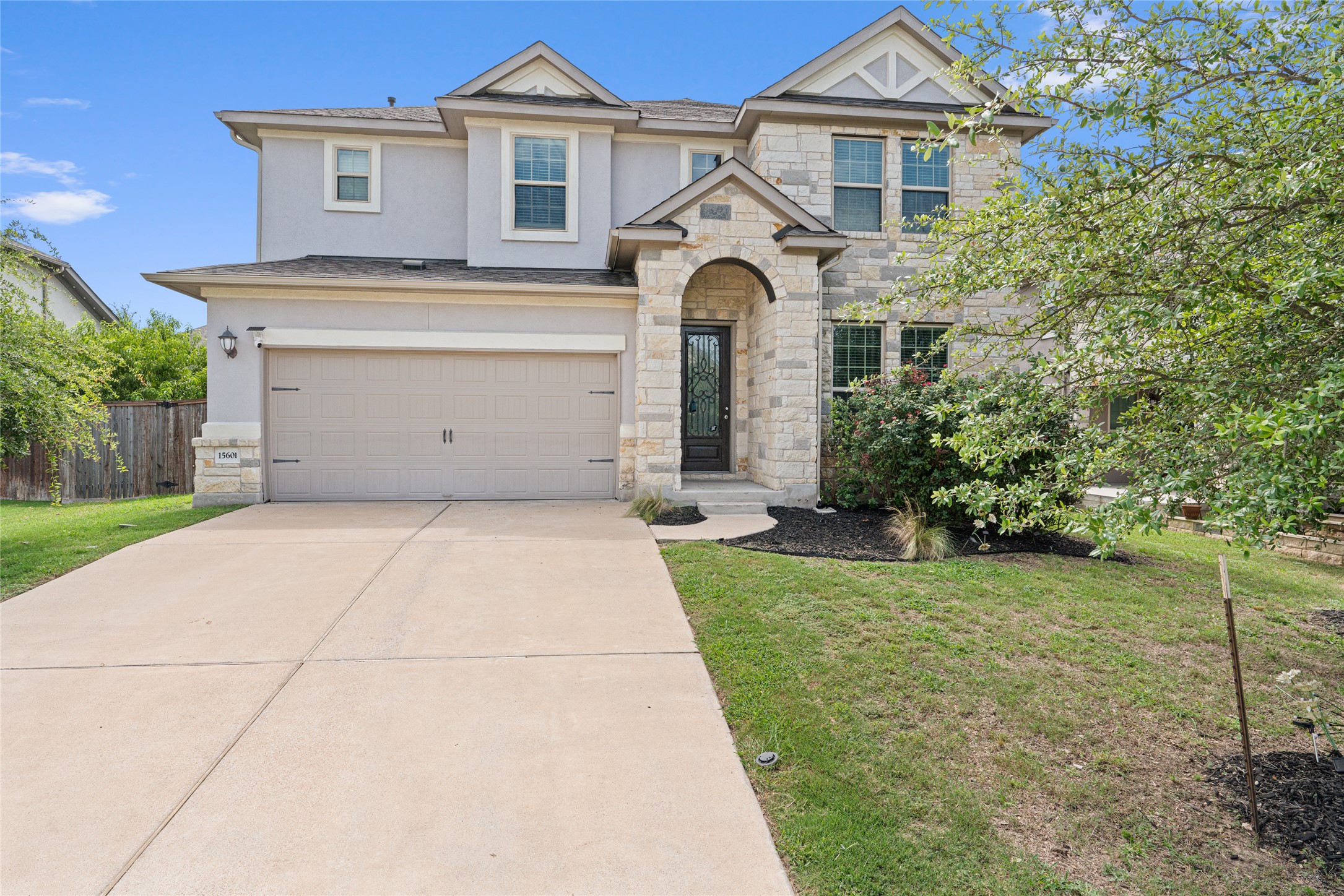 15601 Cabrillo Way Austin, TX 78738 - Photo 2 of 32 Two-story residence featuring stone and stucco exterior