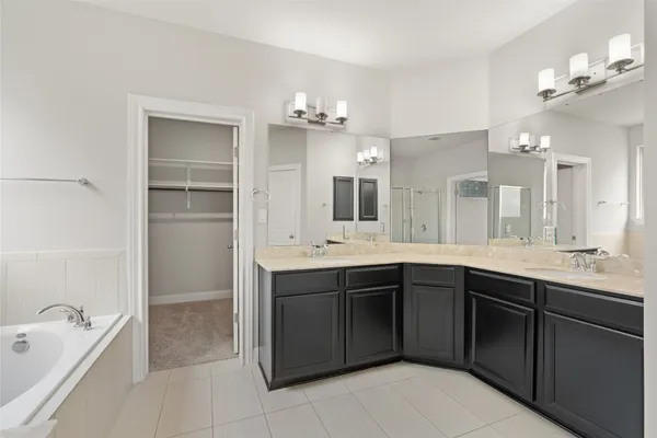 a bathroom with a bathtub and a shower