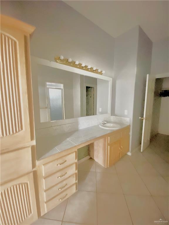 3631 Lott Road Donna, TX 78537 - Photo 11 of 24 a large bathroom with a large tub and sink