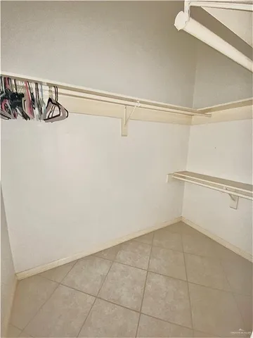 a white toilet sitting next to a small sink