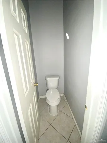 a view of a livingroom with a furniture and chandelier fan