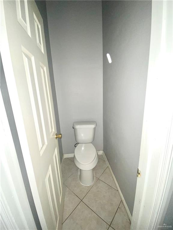 3631 Lott Road Donna, TX 78537 - Photo 13 of 24 a white toilet sitting next to a small sink