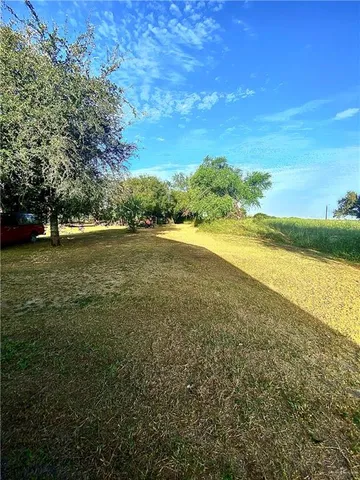 a view of a swimming pool with an outdoor space and seating area