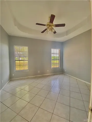 a view of a kitchen with a sink and a refrigerator