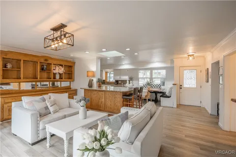 a view of an entryway with wooden floor