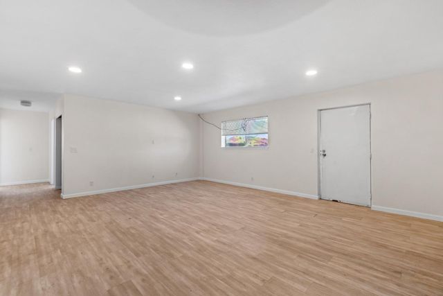 a kitchen with stainless steel appliances granite countertop wooden cabinets a sink and dishwasher