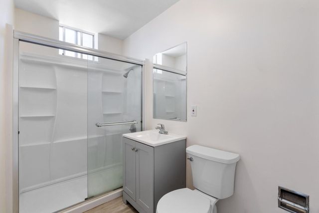 a view of wooden door and glass door